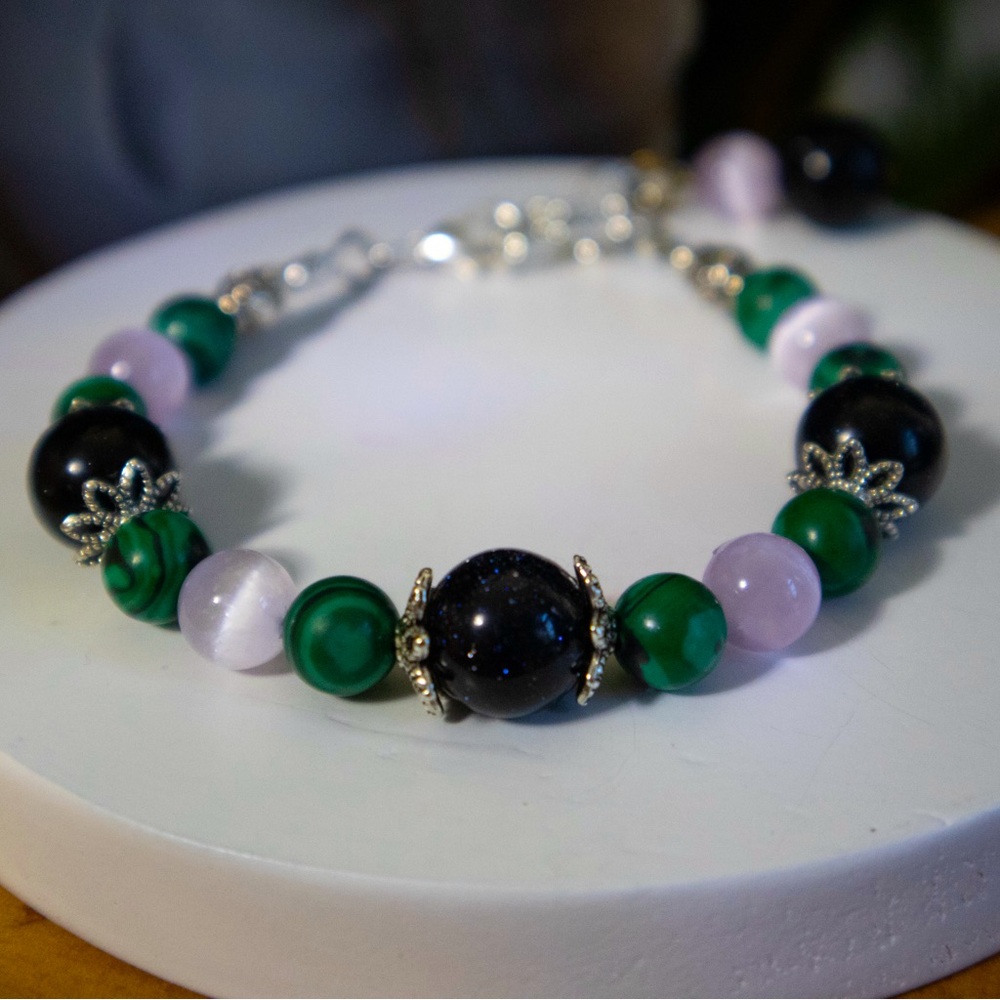 8-10 in handcrafted gemstone bracelet using sandstone, malachite, and selenite.